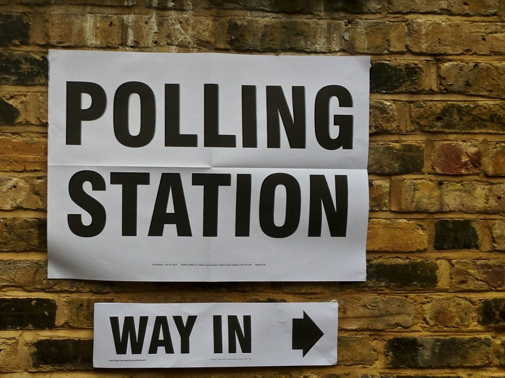 A polling station sign.