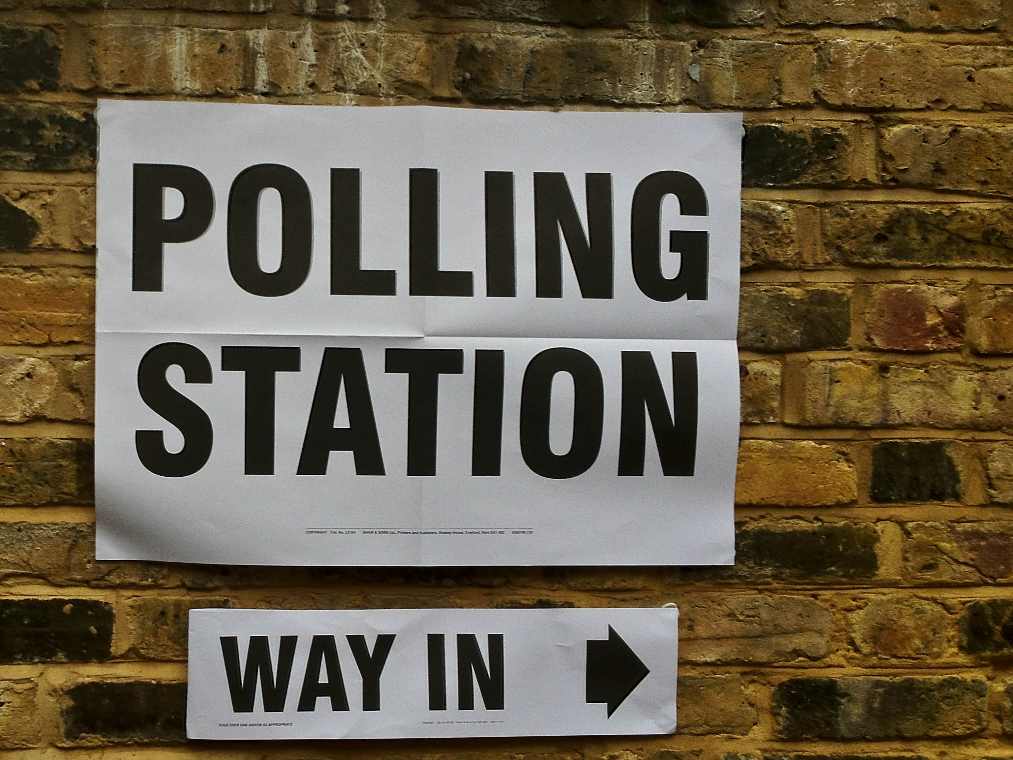 A polling station sign.