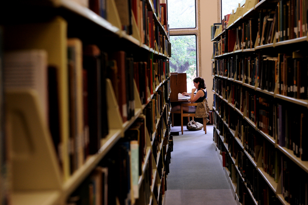 A student reading in a library (Image: Tulane University, under Creative Commons)