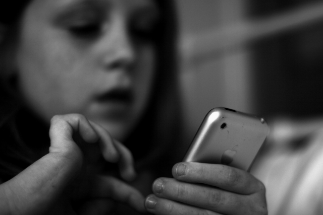 Child using a mobile phone (Image: Anthony Kelly)