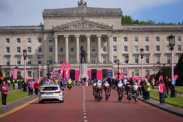 An image showing the start of the Giro d'Italia bike race with Parliament Buildings, Stormont in the background