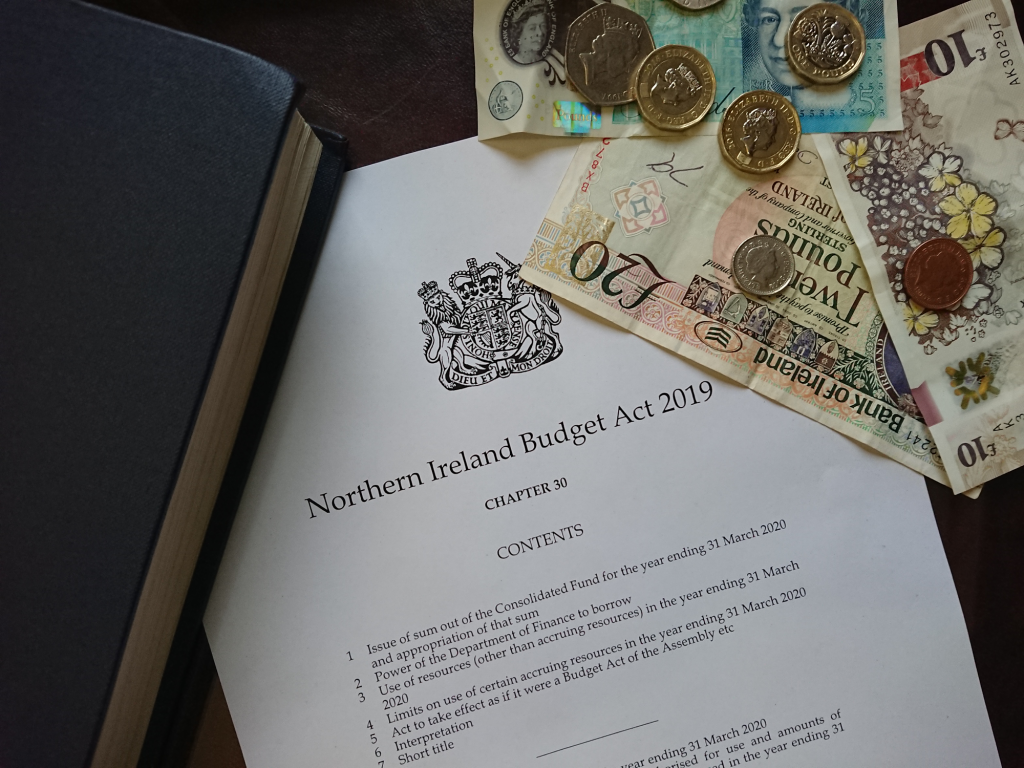 An image showing the Northern Ireland Budget Act 2019, with a selection of cash