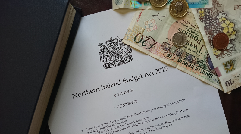 An image showing the Northern Ireland Budget Act 2019, with a selection of cash