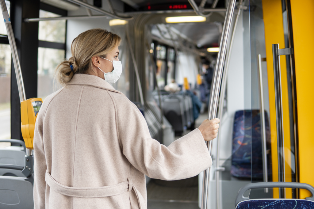 Image of a person wearing a mask on public transport