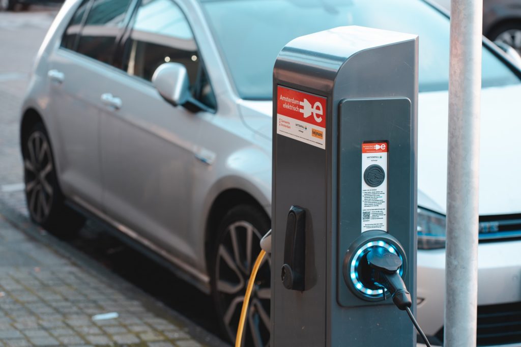 An image of an electric car, charging