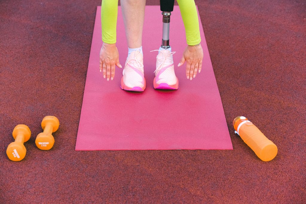 An image showing an athlete with a prosthetic limb exercising