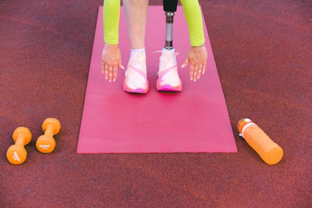 An image showing an athlete with a prosthetic limb exercising
