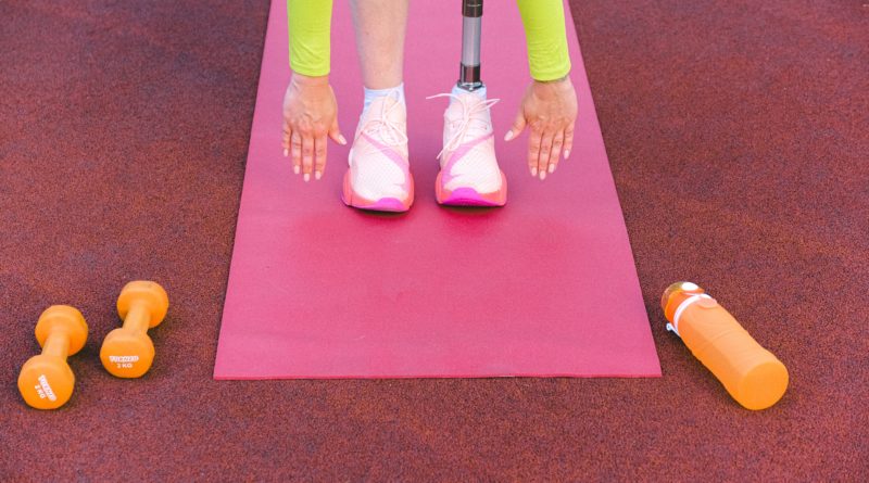 An image showing an athlete with a prosthetic limb exercising