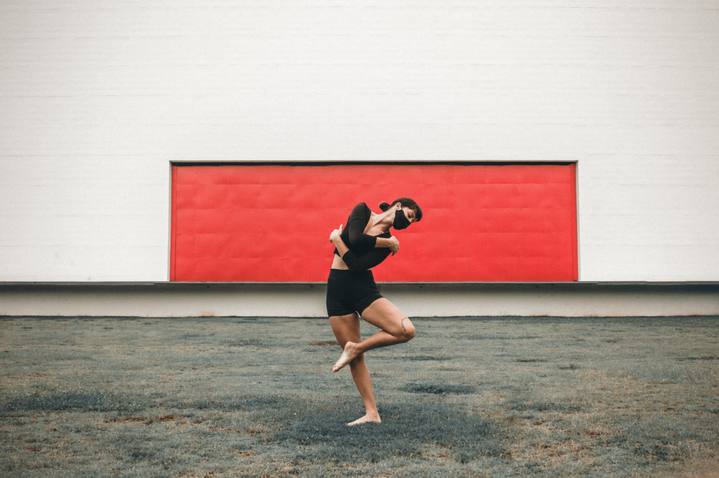 An image depicting a dancer wearing a mask