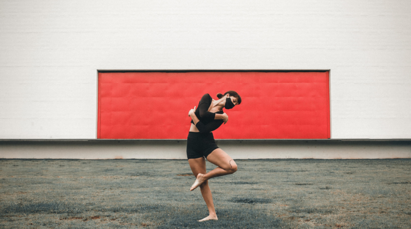 An image depicting a dancer wearing a mask