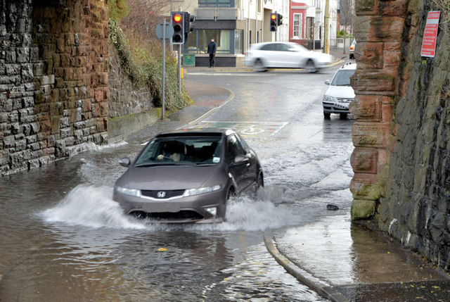 A photograph showing a flood under a railway bridge flood in Holywood 