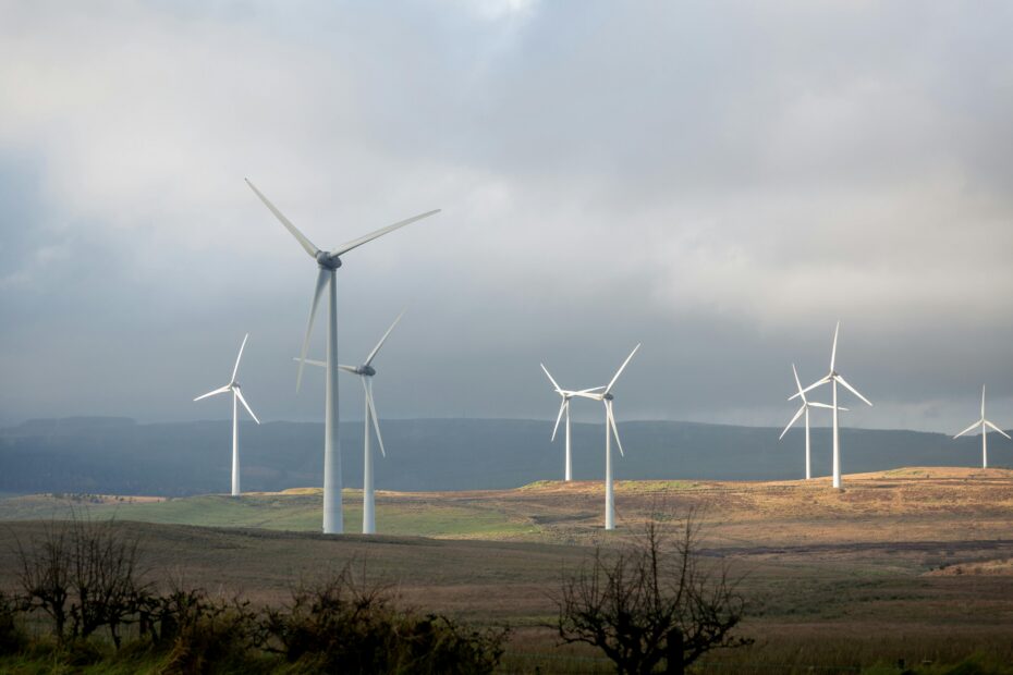 A photograph showing a set of white-coloured wind turbines on some hills in Northern Ireland